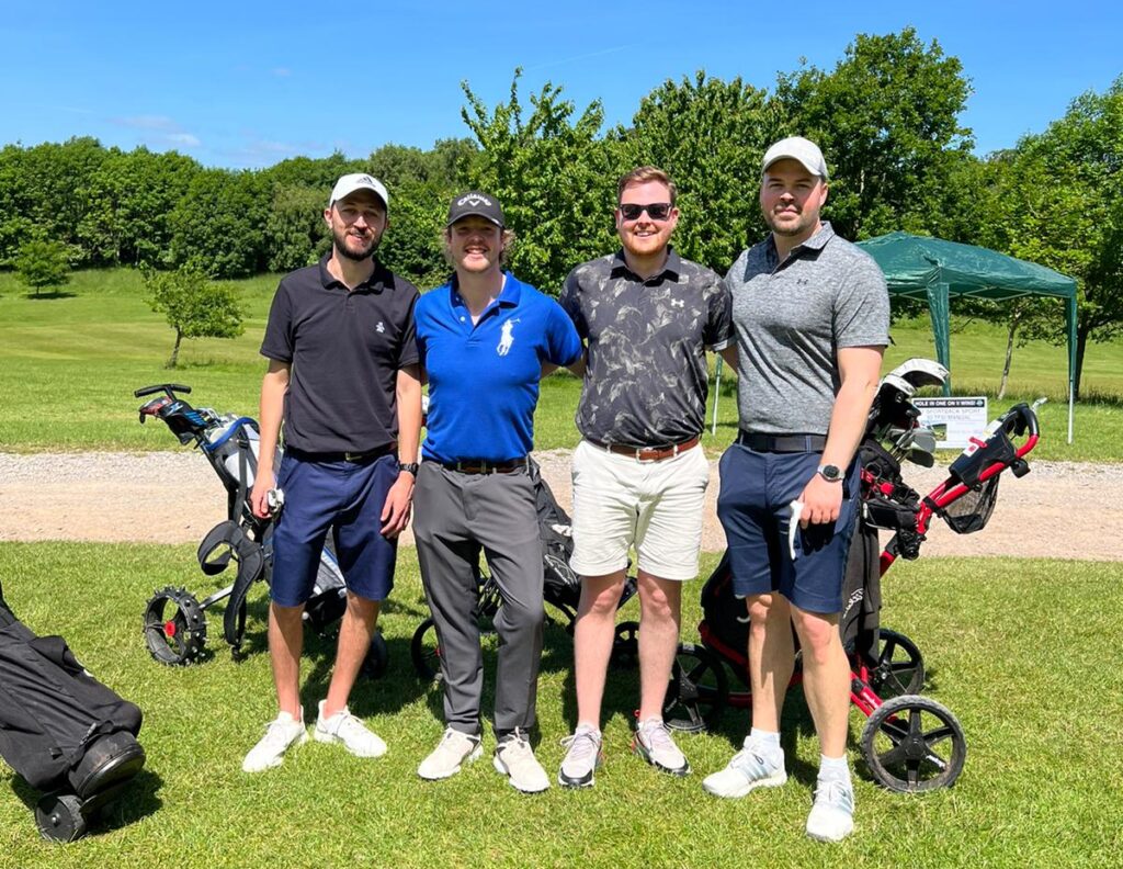 four men at the golf course