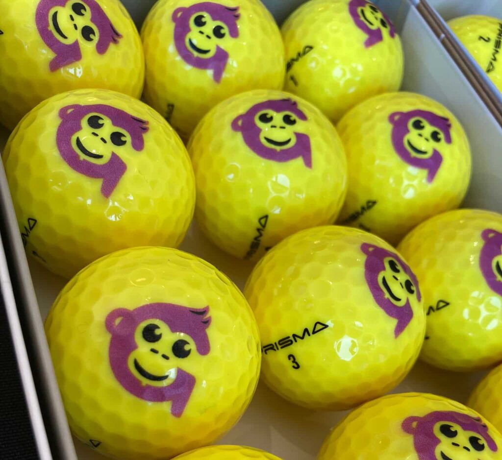 Yellow golf balls with Gympanzees logo