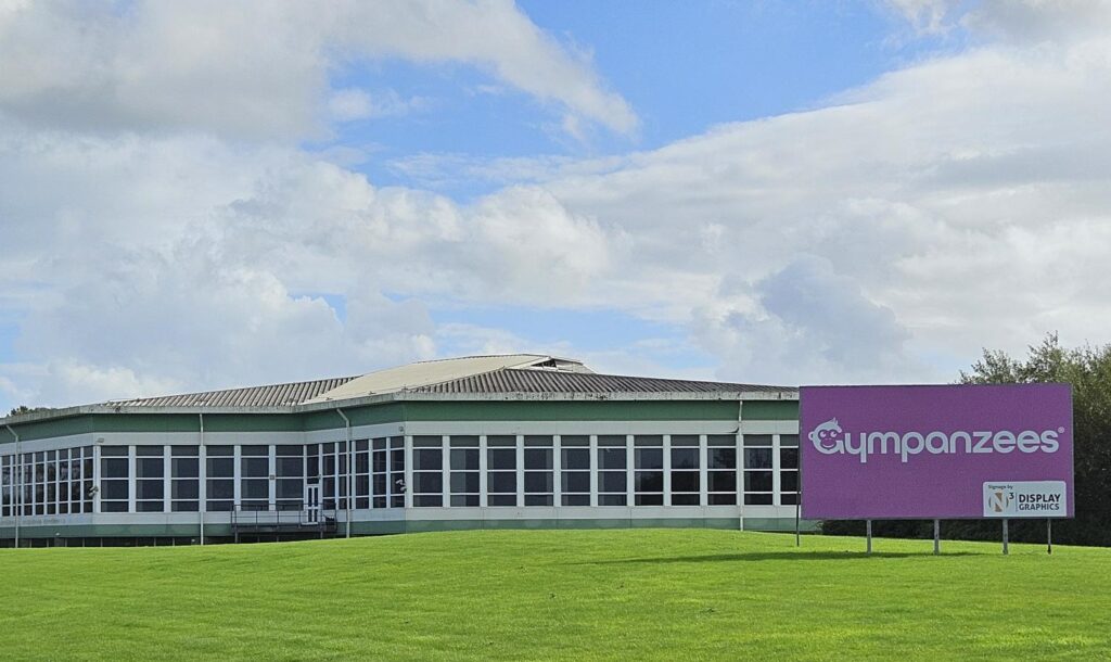 a view of the building with Gympanzees purple sign