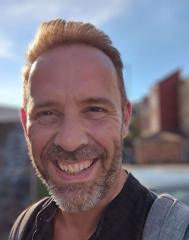 A man smiling for a selfie