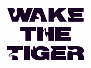 Wake the Tiger Logo in bold font lined up vertically.