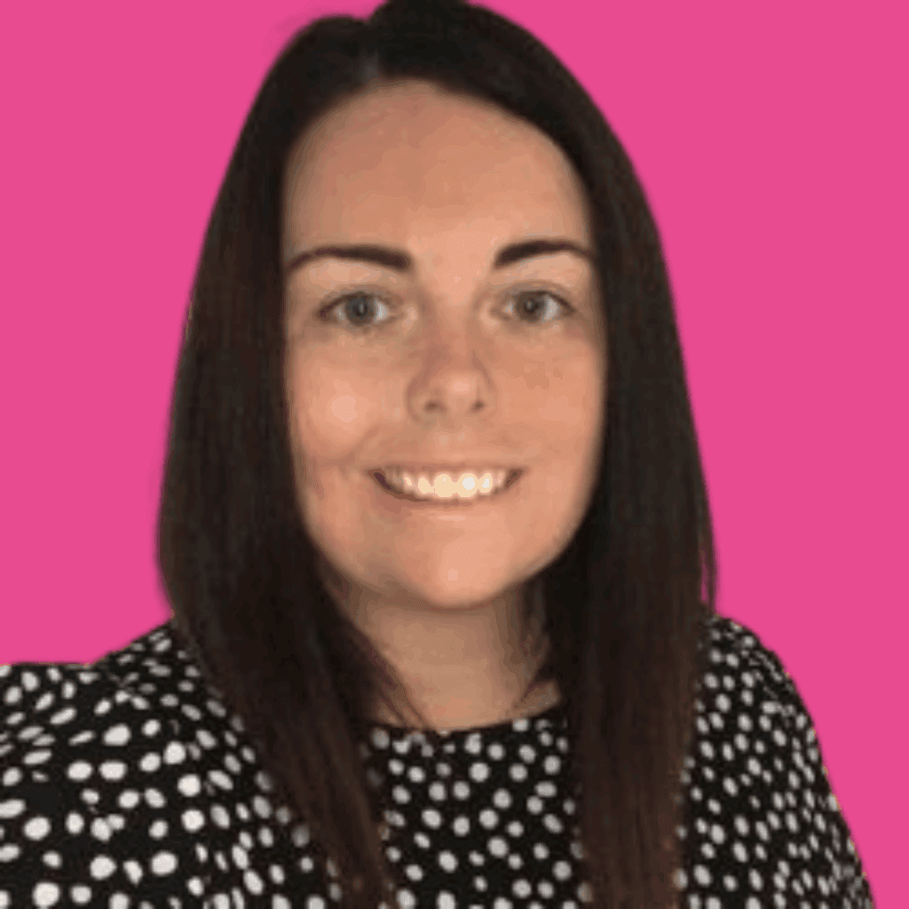 The image is of a woman with short dark straight hair, in a dark top, from the shoulders up smiling into the camera, on a brightly coloured background.