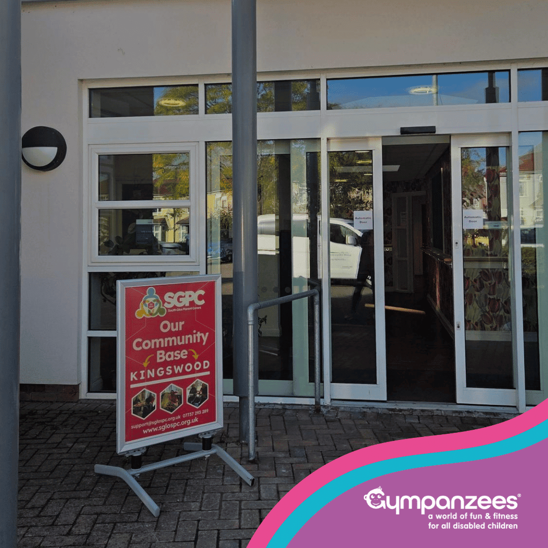 Entrance of SPCC Our Community Base Kingswood, featuring glass doors and Gympanzees logo in the bottom right.