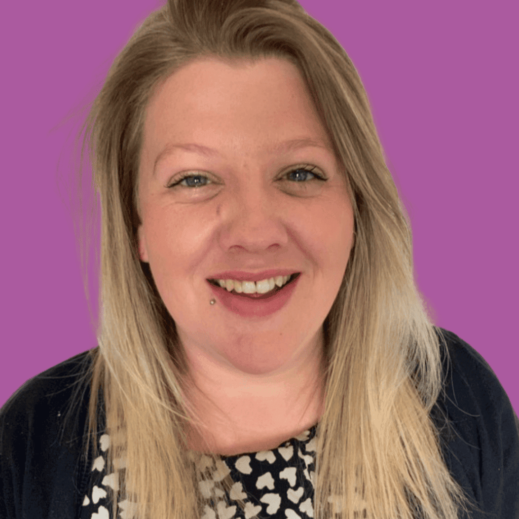 The image is of a woman with light, long hair, from the shoulders up, in a brightly coloured top smiling into the camera on a brightly coloured background.