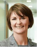 a photo of a woman with short brown hair smiling