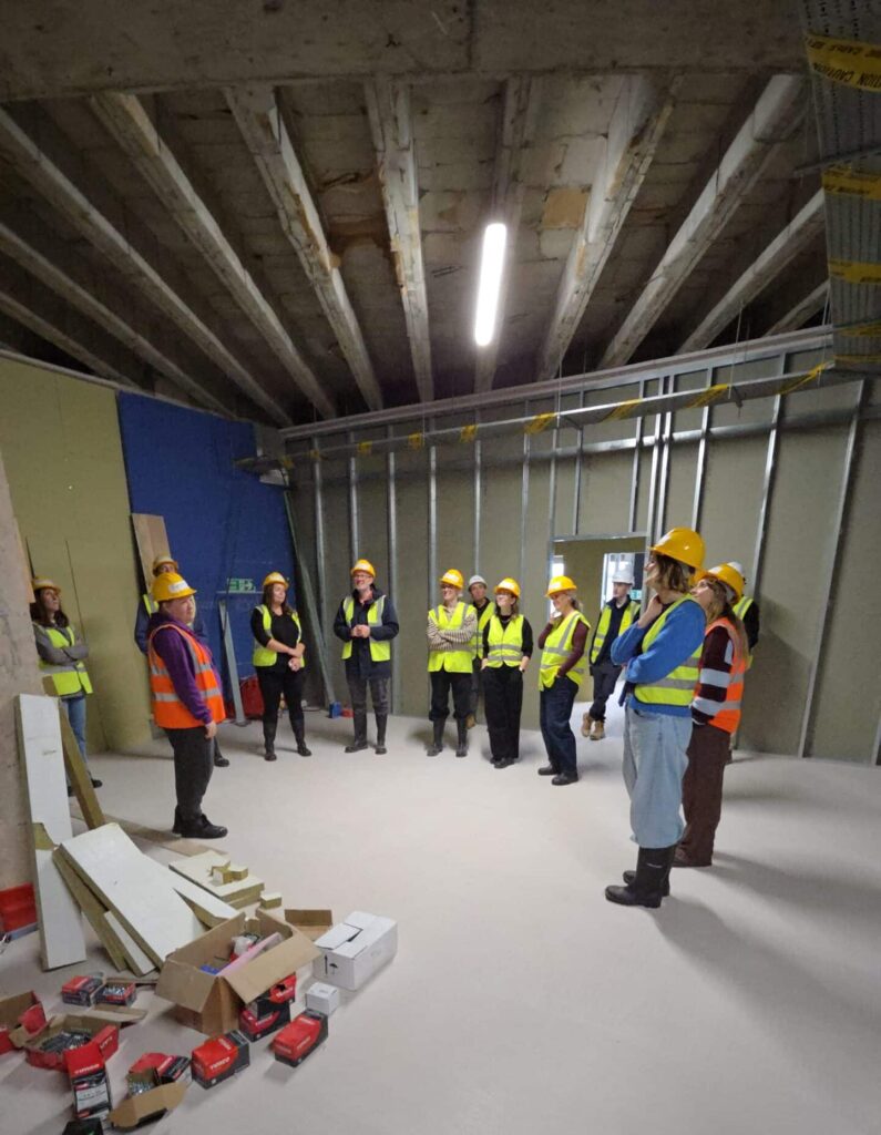Gympanzees team on site all wearing protective clothing