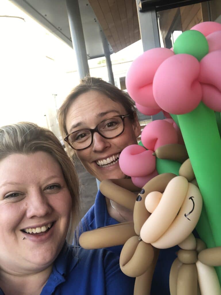 Fran and Steph holding ballon monkey
