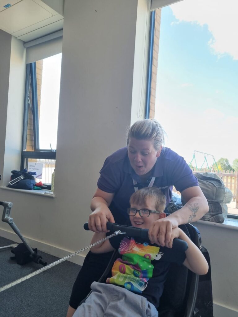 Fran assisting a child at Gympanzees Pop Up